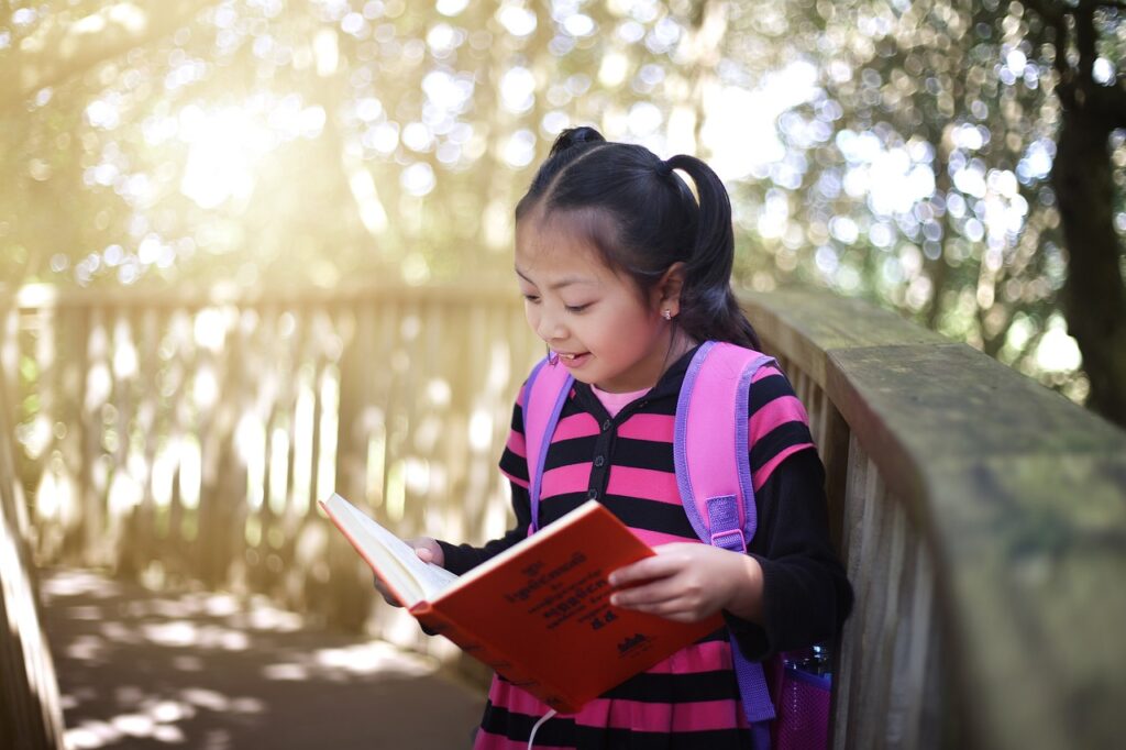 girl, reading book, outdoors-5819259.jpg
